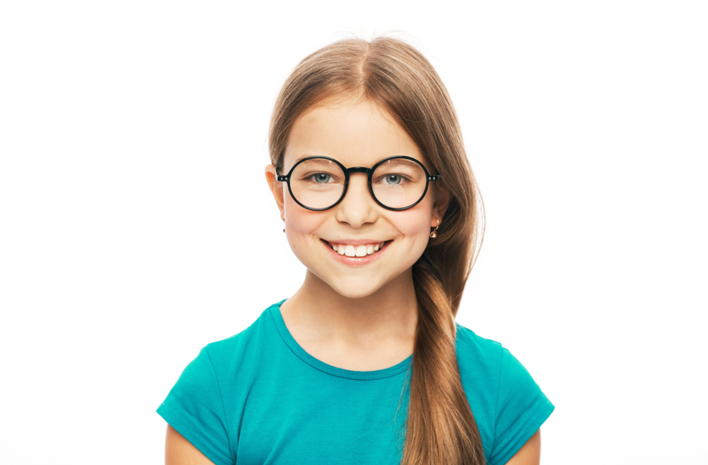 A portrait of a young girl wearing eyeglasses for correcting her myopia