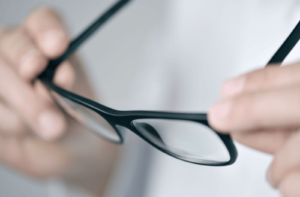 A close up view of a pair of black-rimmed glasses.