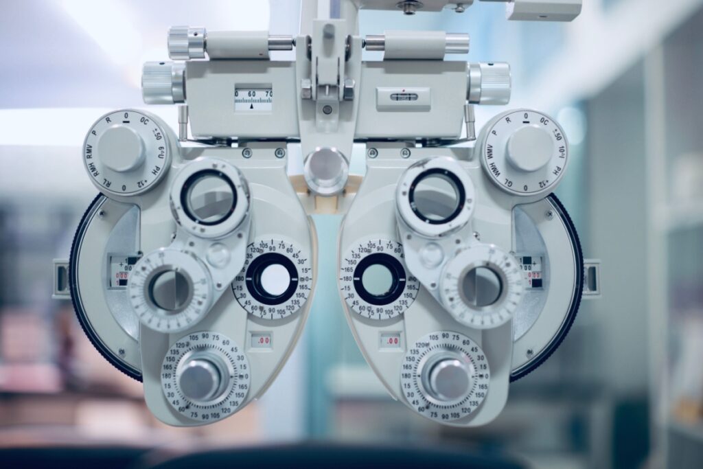 A photo of a phoropter being used during an eye exam